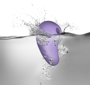 Rocks Off Sugar Boo Peek A Boo Suction Vibrator Lilac displayed in a serene setting, demonstrating its waterproof features and versatility for couples or solo pleasure.